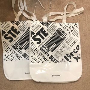 2 white Lulu shopping bags